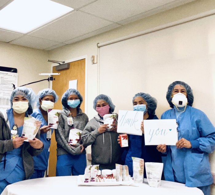 Hospital workers holding Thank You signs for HumanN