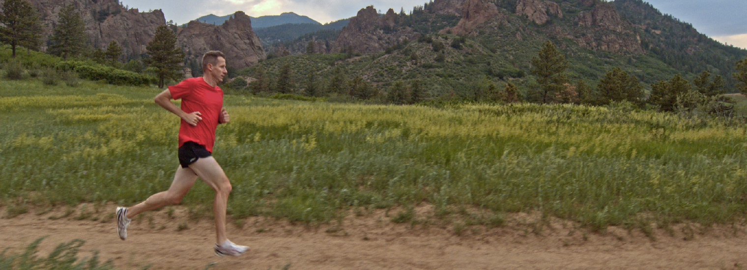 Hunter Kemper running through a valley