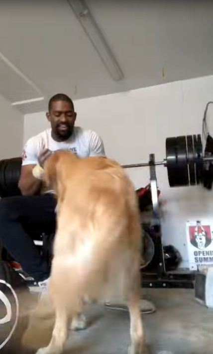 Andre Crews working out with his dog