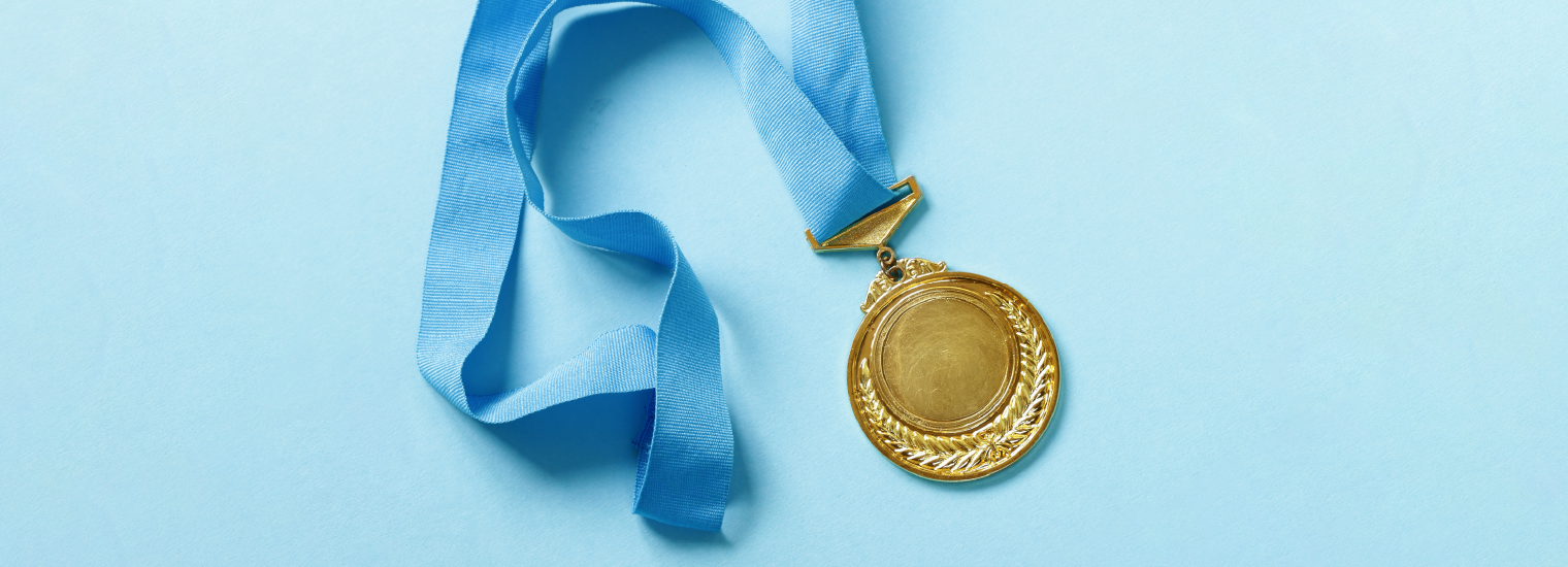 Gold medal with blue ribbon