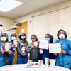 Hospital workers holding Thank You signs for HumanN