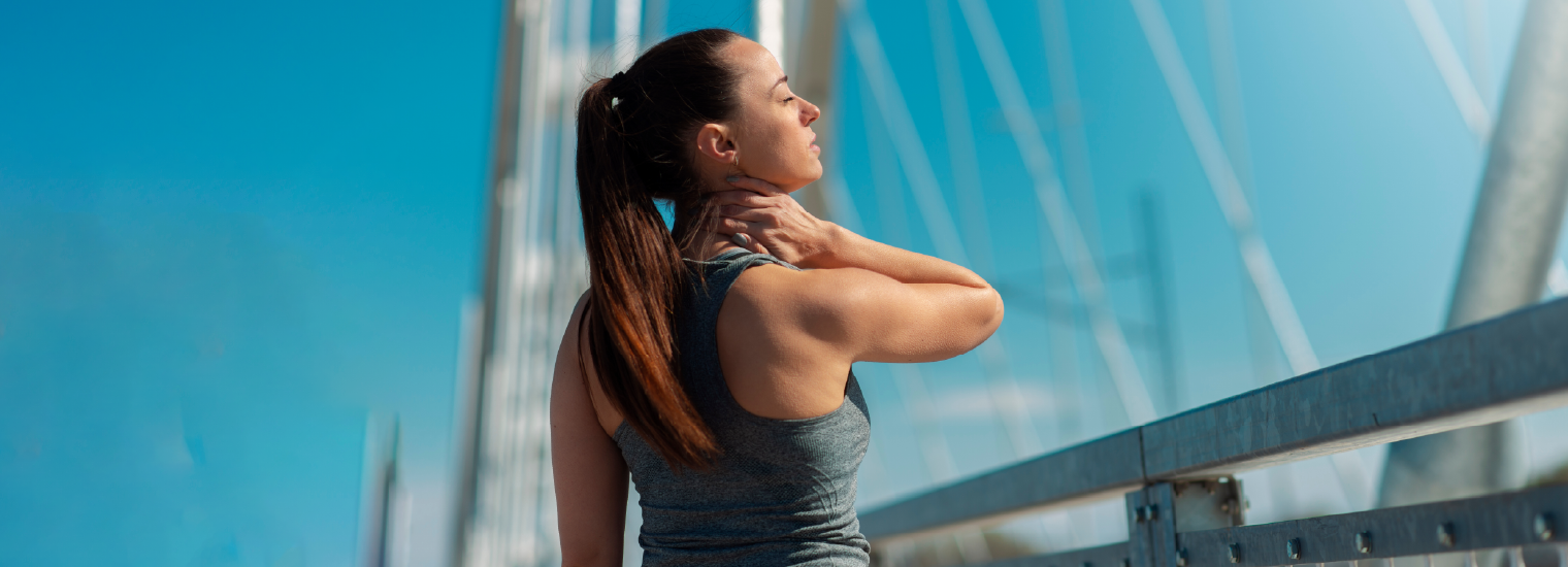 Athletic woman experiencing neck pain