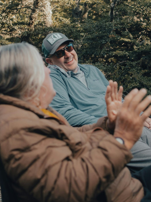 Couple laughing together outdoors