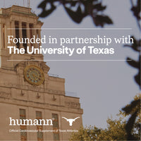 University of Texas clock tower with 'humann' partnership text